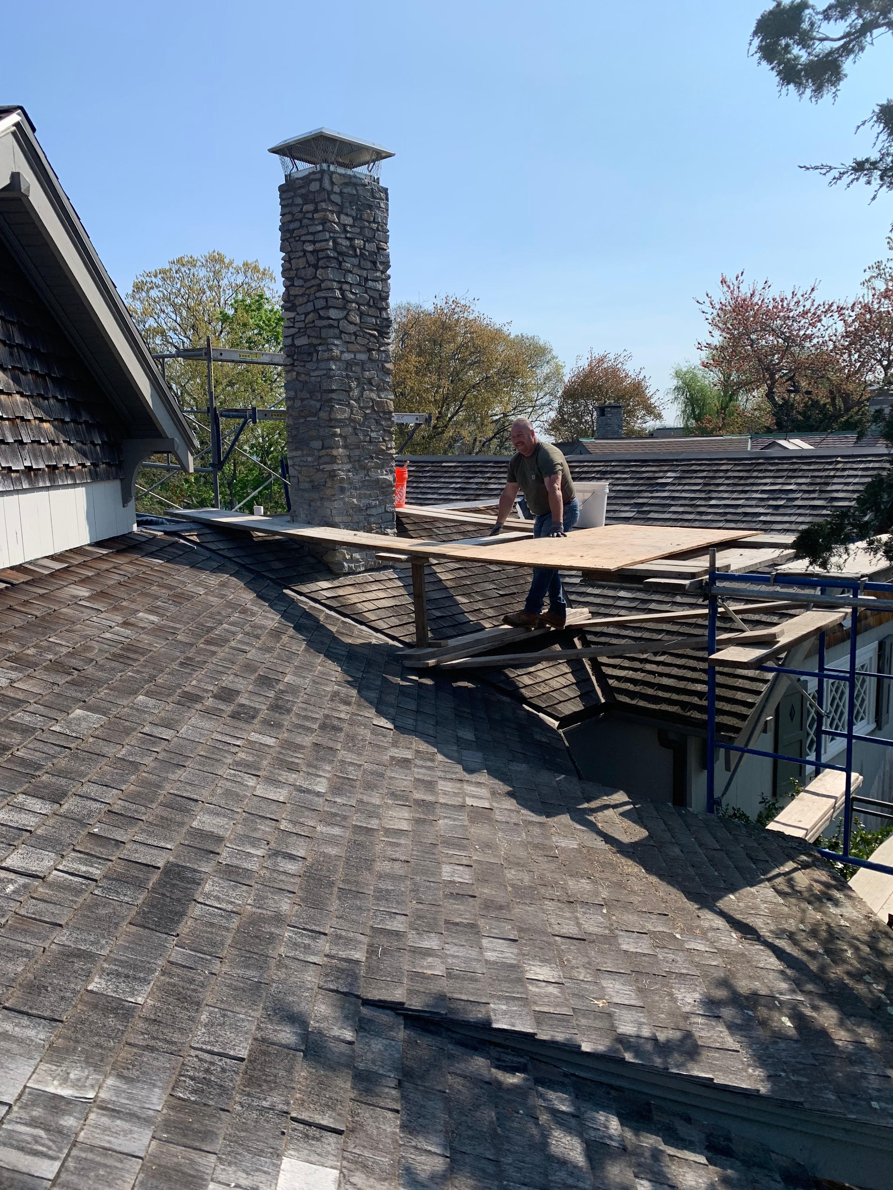 Residential stone chimney repair by KL Construction Co